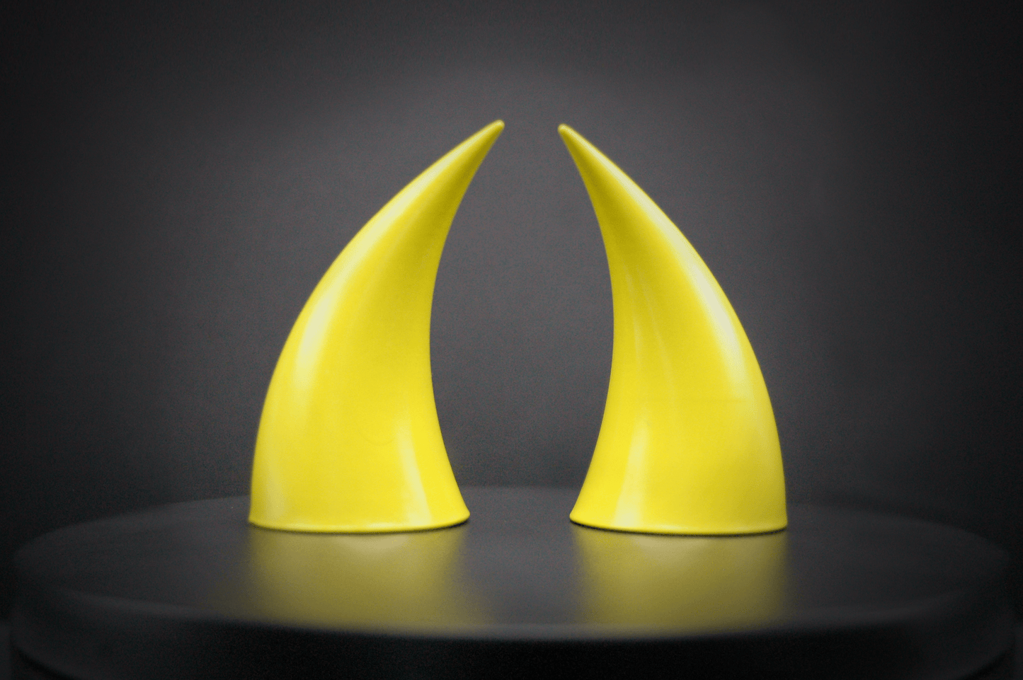 Back view of incubus devil horns in sulfur yellow with a glossy finish.