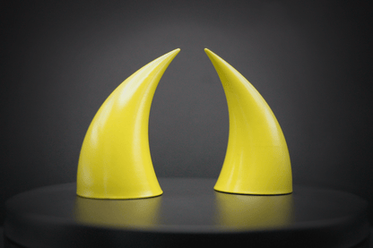 Side view of incubus devil horns in sulfur yellow with a glossy finish.