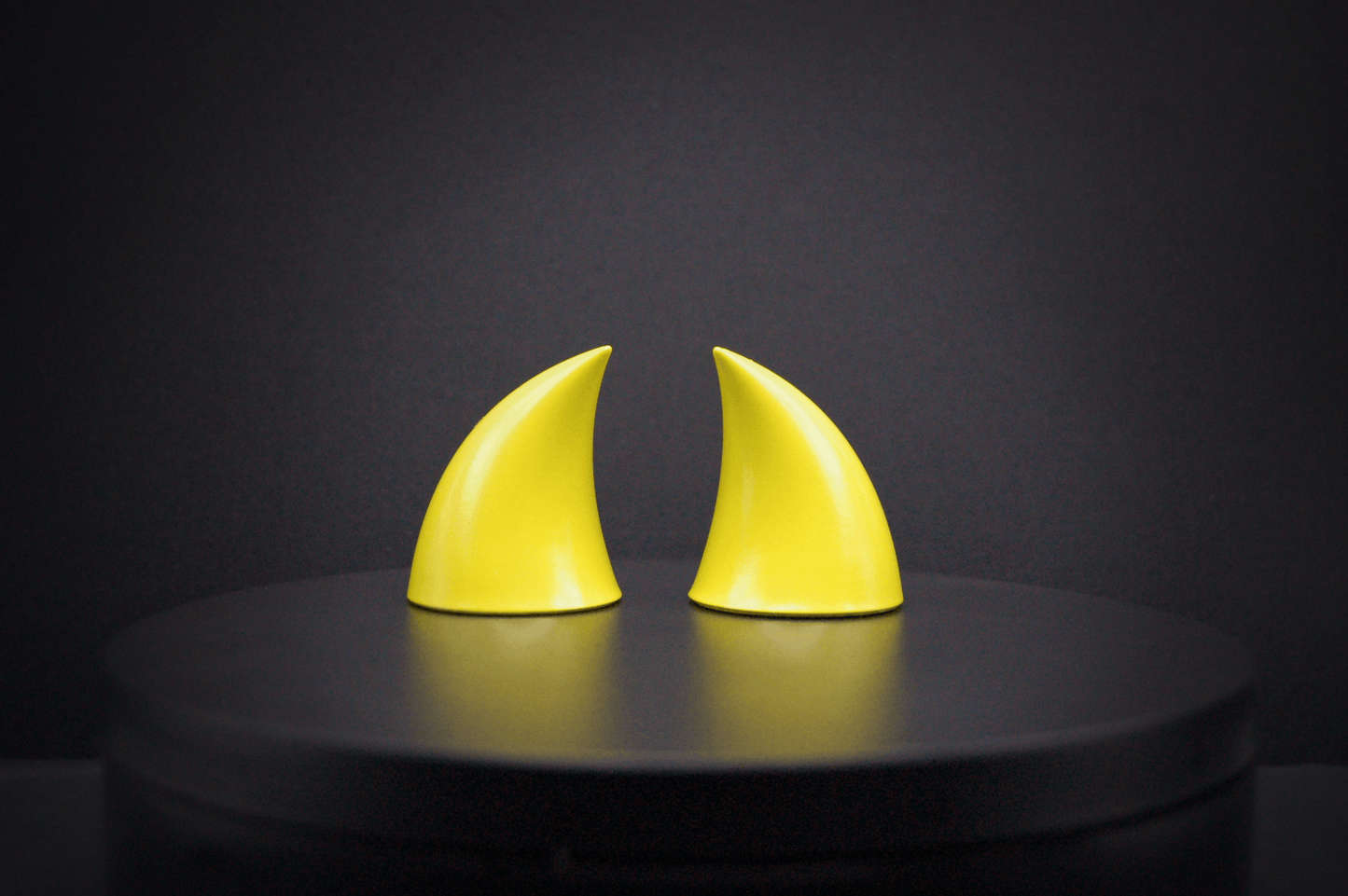 Back view of imp devil horns in sulfur yellow with a glossy finish.