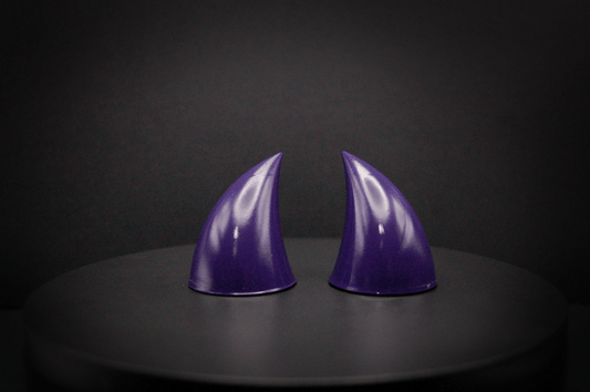 Front view of imp devil horns in belladonna violet, a dark purple with a glossy finish.