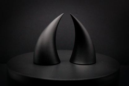 Side view of incubus devil horns in black with a matte finish.