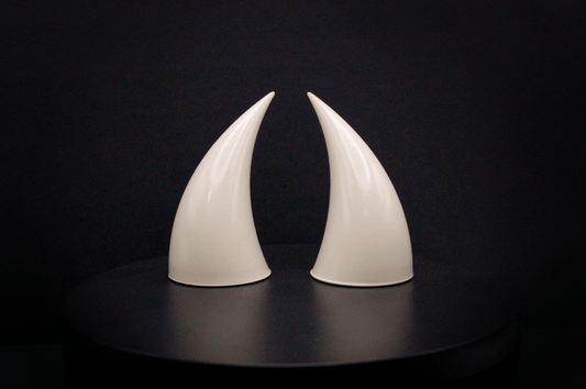 Front view of incubus devil horns in bone white with a glossy finish.