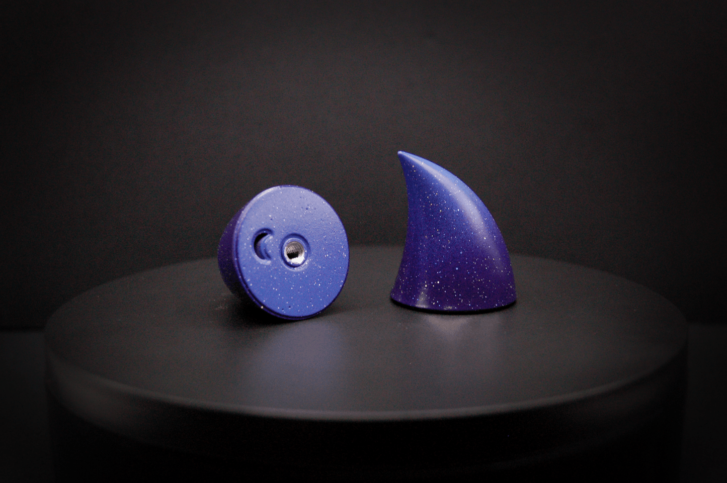 Bottom view of imp devil horns in a royal purple to periwinkle ombré with a glittery finish, showing a threaded insert on the base.