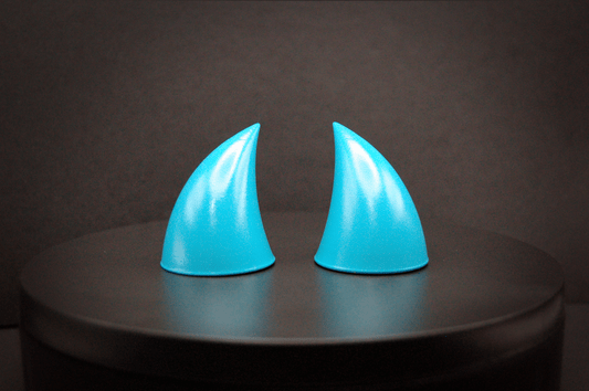 Front view of imp devil horns in naiad blue, a cyan color with a glossy finish.