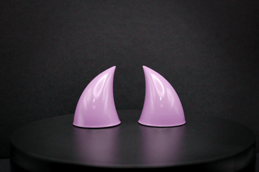 Front view of imp devil horns in lilac with a glossy finish.