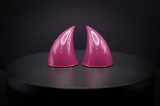 Front view of imp devil horns in deep rose with a glossy finish.