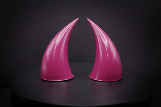 Front view of incubus devil horns in deep rose with a glossy finish.