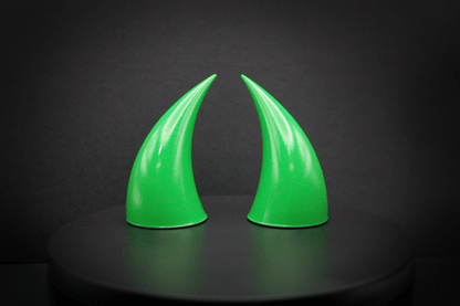 Front view of incubus devil horns in goblin green, a bright green with a glossy finish.