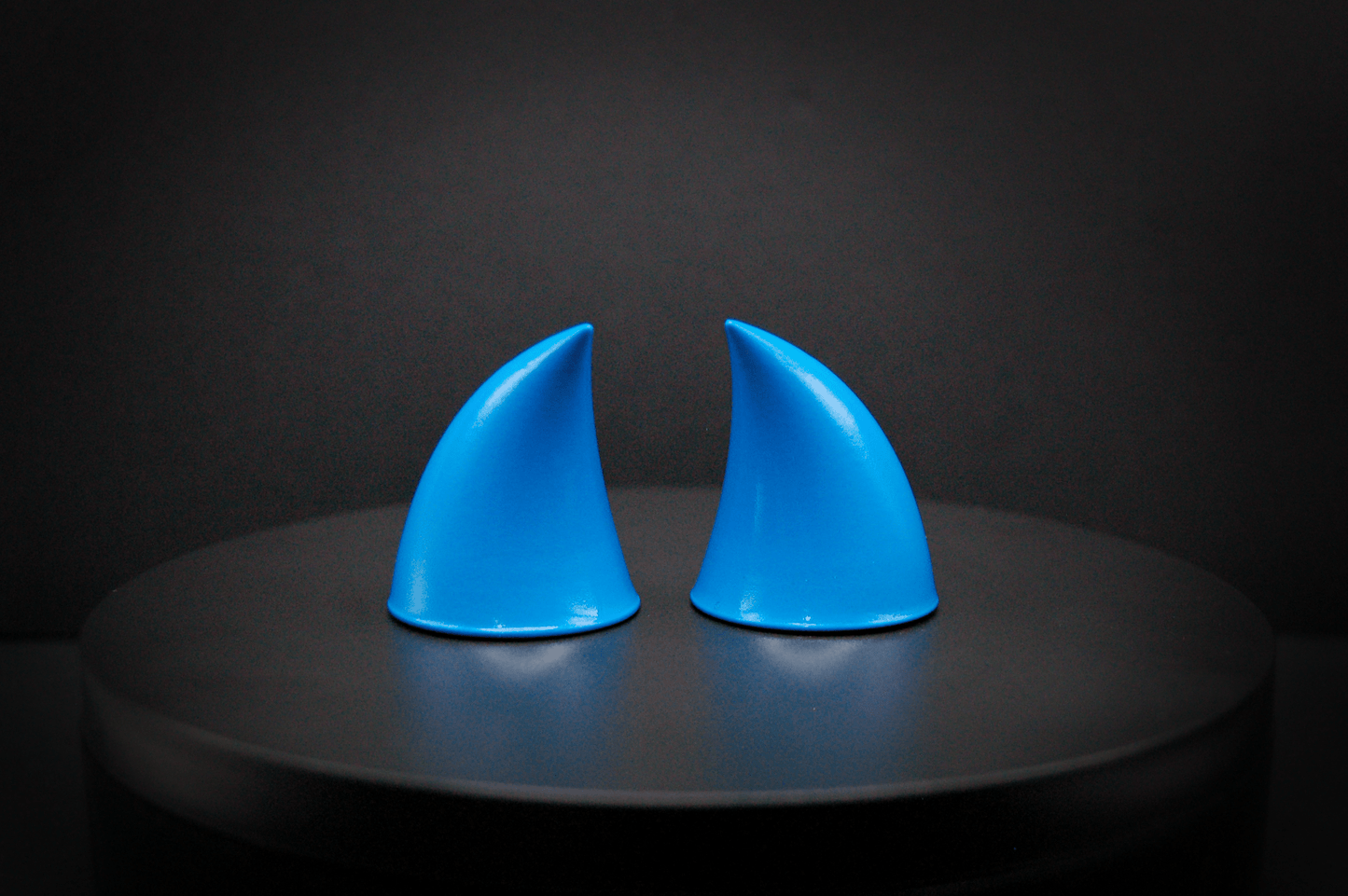 Back view of imp devil horns in nixie blue, a turquoise color with a glossy finish.