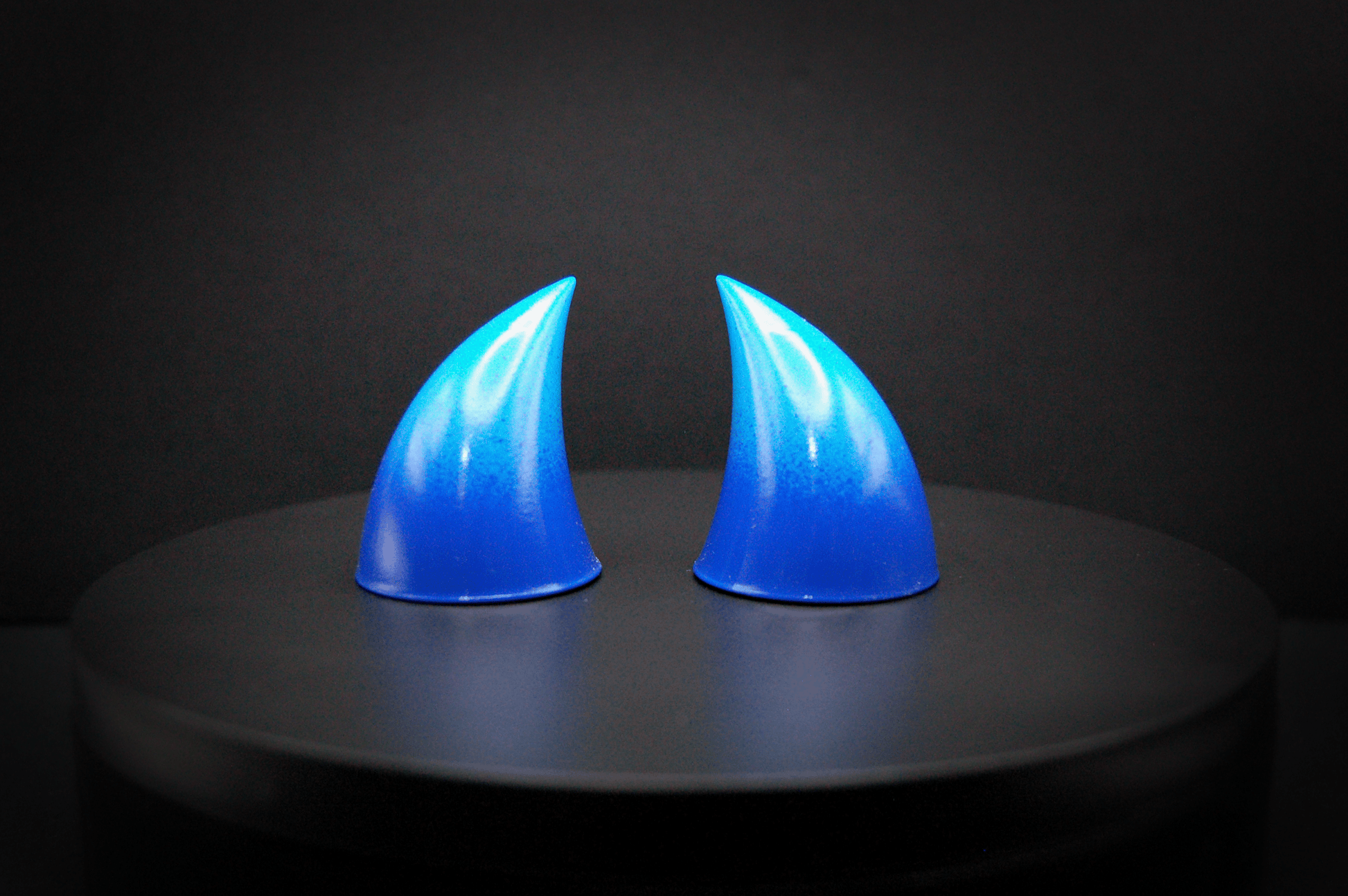 Front view of imp devil horns in a royal blue to sky blue ombré with a glossy finish.